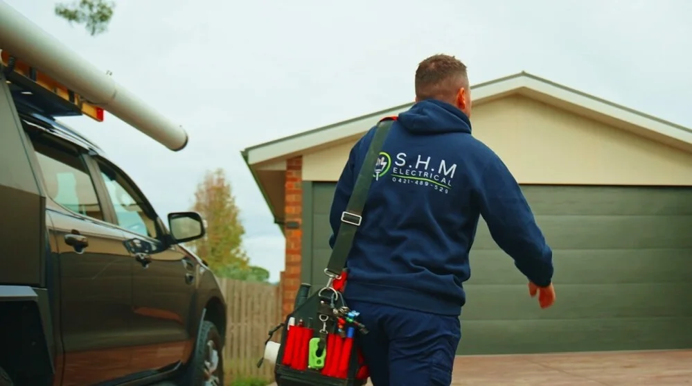 S.H.M Electrical electrician arriving on site with a fully stocked tool bag